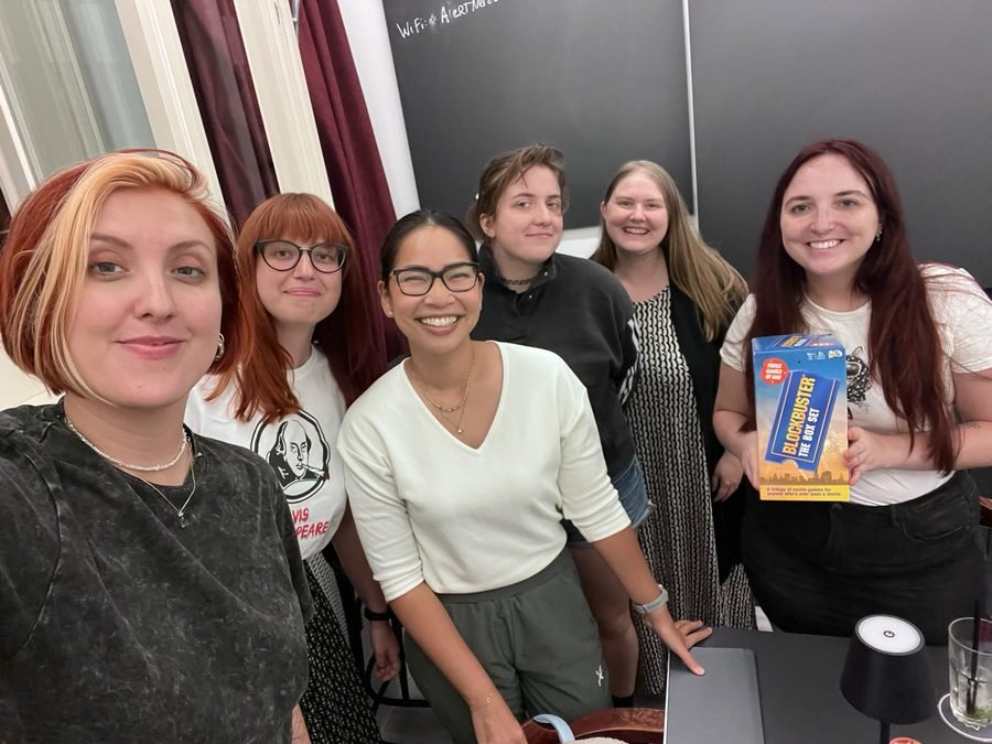 Kino Klub members playing a movie trivia box game