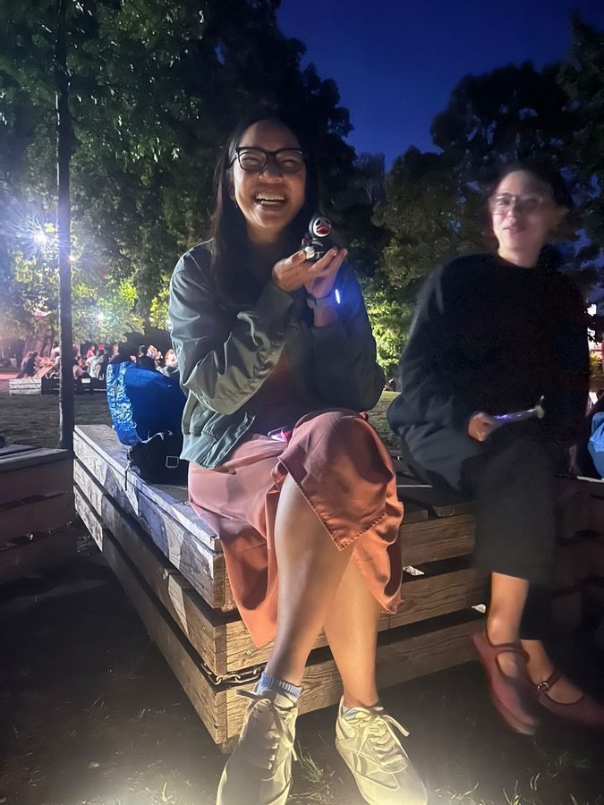 Kino Klub member laughing at an outdoor evening screening